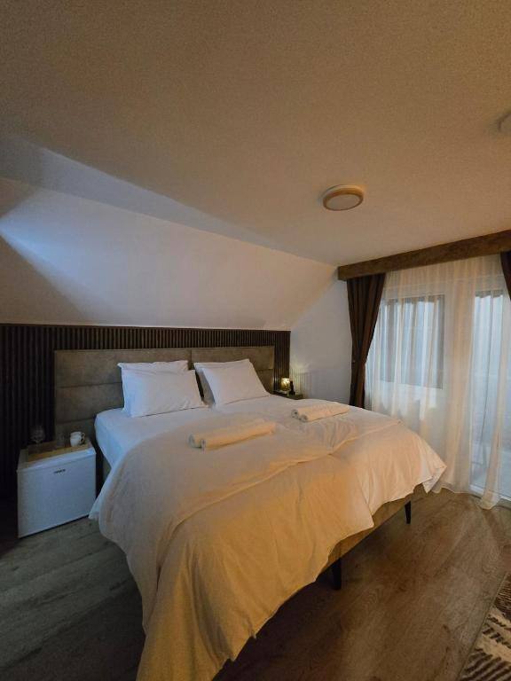 Bright room with upholstered headboard and large window